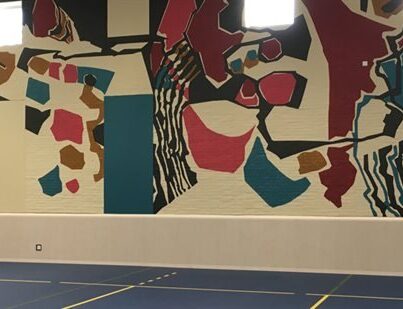 Replica van de wandschildering van Frieda Hunzker in de Goeman Borgesiusschool in Amsterdam